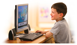 young boy learning on the computer